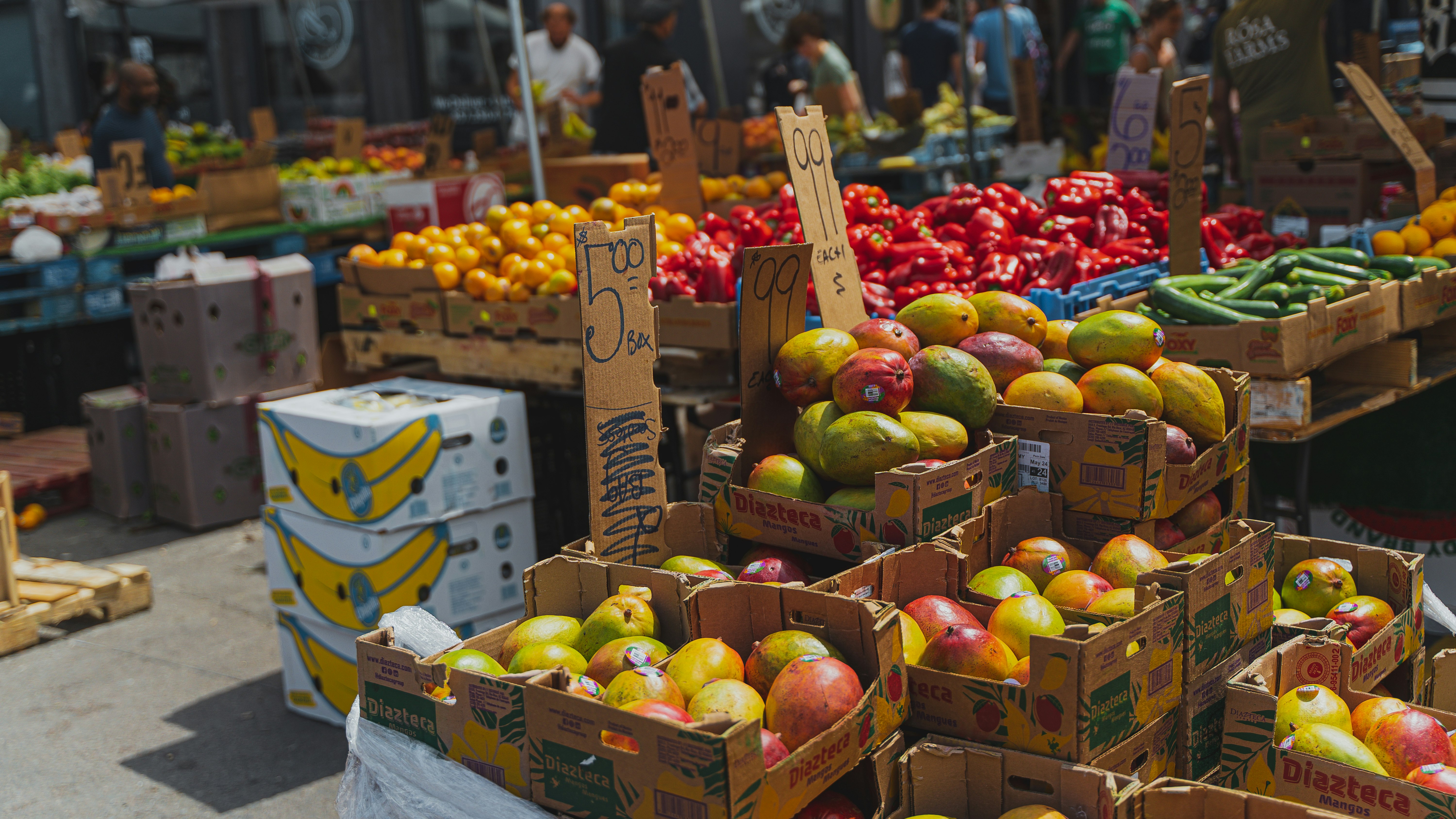 red and green apples on brown wooden crate